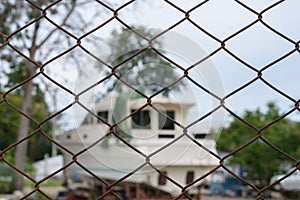 Steel wire mesh fence with blur boat