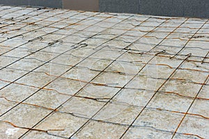 Steel wire mesh lying on concrete before pouring the cement floor photo