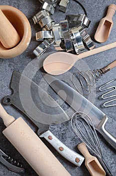 Steel and wooden kitchen utensils on a table