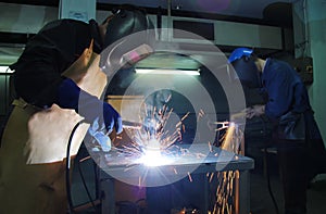 Steel workers welding