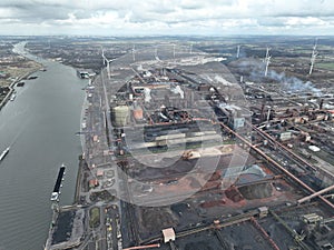 Steelmaking at blast furnace Ghent in Belgium. Cranes at loading port for ships to load and unload raw materials in the