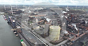 Steelmaking at blast furnace Ghent in Belgium. Cranes at loading port for ships to load and unload raw materials in the