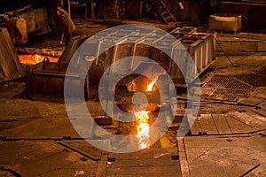 Steelworker near a blast furnace photo