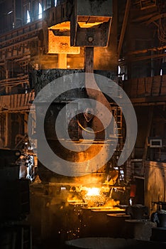 Steelworker near the tanks with hot metal