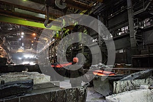 Steelworker at work at a steel mill photo