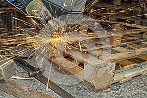 Steelworker working with a grinding tool
