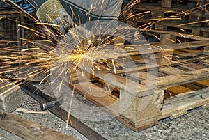 Steelworker working with a grinding tool photo