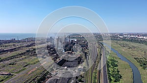 Steelworks. Aerial view of industrial zone with fuming chimneys.