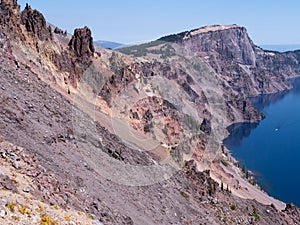 Steep cliff and the blue Crater Lake Oregon