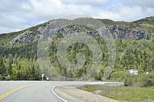 Steep cliff face and forest along Newfoundland highway