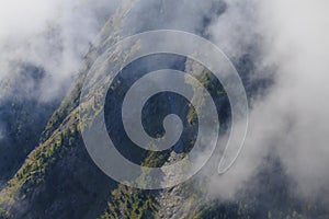 Steep cliff in French alps at summer time