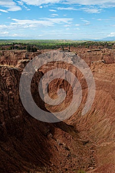 Steep cliff and valley of red orange sand stone