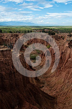 Steep cliff and valley of red orange sand stone