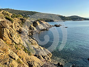 Steep cliffs that descend directly into the sea in Sarti resort, Greece