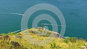 On the steep cliffs of Laem Krating longtail boats pass this route