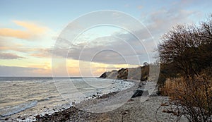 Steep coast with beach and stones at the Baltic Sea in Mecklenburg-Western Pomerania, Germany, copy space