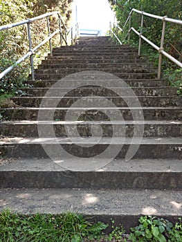 Steep Concrete Steps eading to Footbridge with Steel Railings photo