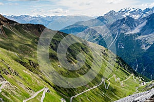 Steep descent of mountain road Stelvio pass, in Italian Alps