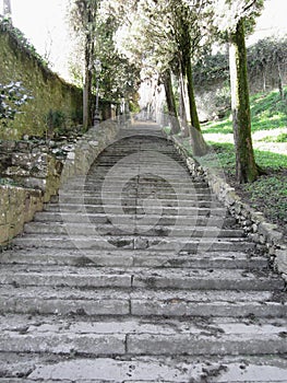 Steep flight of stairs leading up to medieval village of Volterra, Province of Pisa, Tuscany, Italy