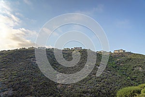 Steep green slope of a mountain in a low angle view at Double Peak Park