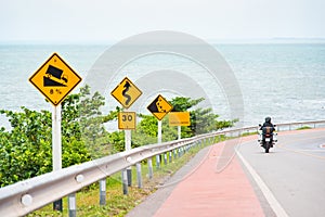 Steep Hill Descent Use Low Gear Traffic Sign on the Road in Thai
