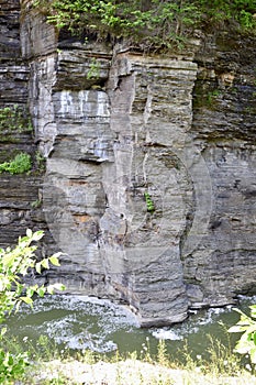 Steep limestone cliff along the Genesee River at Letchworth