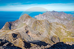 Steep mountains of Lofoten Island on a sunny arctic day. View from the top of Hermannsdalstinden peakHiking mountains of Lofoten,