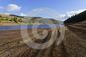 On the steep, muddy sides of Ladybower reservoir