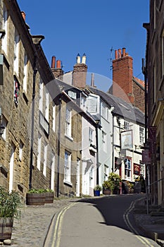 Steep narrow street with houses on either side