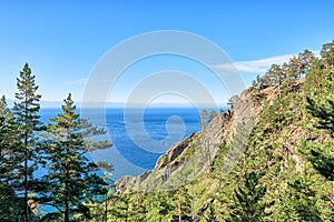 Steep rocks covered with pine forest