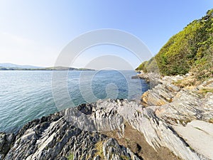 The steep, rocky shoreline of the River Dwyryd in Gwynedd, Wales