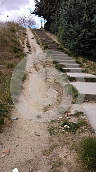 Steep sandy slope with wooden stairs