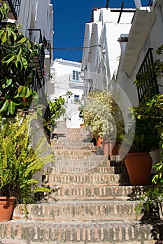 A steep, stepped alley in the old quarter of the Spanish village of Frigiliana on the Costa del Sol.