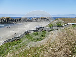 Steep wooden stairway on Bandon beach, Oregon coast