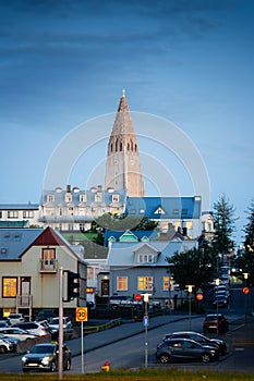 Steeple Hallgrimskirkja Lutheran parish church among the urban village in the dawn at Reykjavik, Iceland