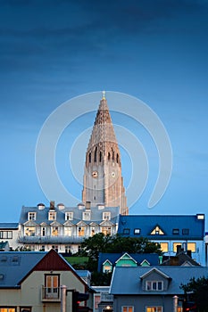 Steeple Hallgrimskirkja Lutheran parish church among the urban village in the dawn at Reykjavik, Iceland