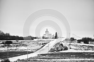 Steepled church in winter landscape