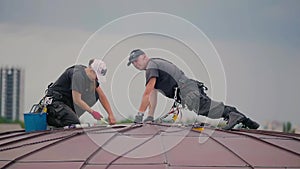 Steeplejacks on the dome of the building