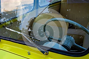 Steering wheel behind the windshield