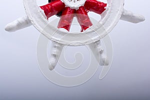 Steering wheel of a boat on white