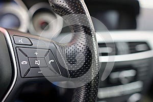 Steering wheel of car, details of phone adjustment controls