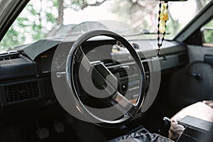 Steering wheel in the cockpit of an old car Moskvich 41