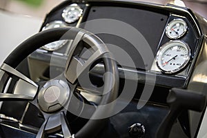 Steering wheel and dashboard of a motor boat