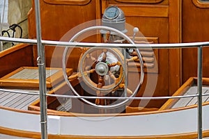 Steering wheel on the deck of a boat