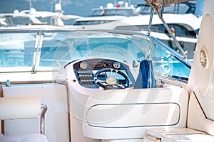 Steering wheel on expensive luxury yacht cabin. Detail of the interior of yacht