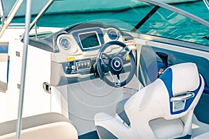 Steering wheel on expensive luxury yacht cabin. Detail of the interior of yacht
