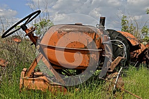 Steering wheel and gas tank remain of tractor photo