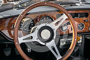 Steering wheel inside old car interior photo