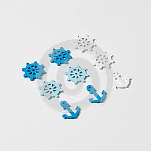 Steering wheels and ship anchors pattern with shadows.