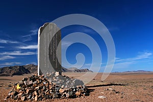 Stele dedicated to Mandukhai or Mandukhai Khatun Queen Mandukhai the Wise in the steppe of Mongolia on a sunny day